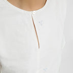 Front Detail of a Model wearing Hand Embroidered Organic Cotton Paneled Top