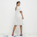 Back View of a Model wearing White Hand Embroidered Organic Cotton Knee Length Shift Dress