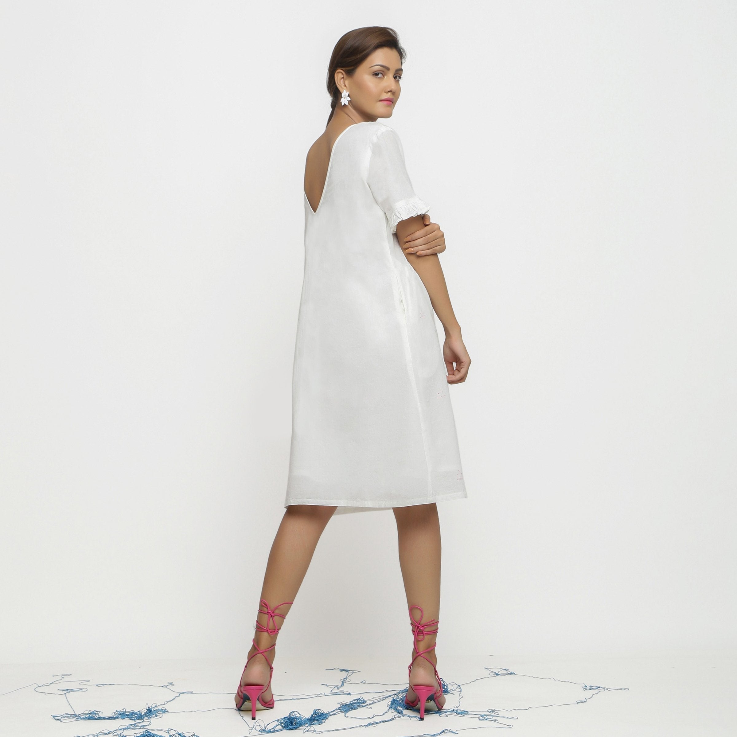 Back View of a Model wearing White Hand Embroidered Organic Cotton Knee Length Shift Dress