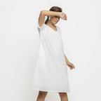 Right View of a Model wearing White Hand Embroidered Organic Cotton Knee Length Shift Dress