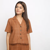 Front View of a Model wearing Handspun Brown Fringe Button-Down Shirt