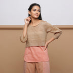 Front View of a Model wearing Handspun Beige Yoked Round Hem Top