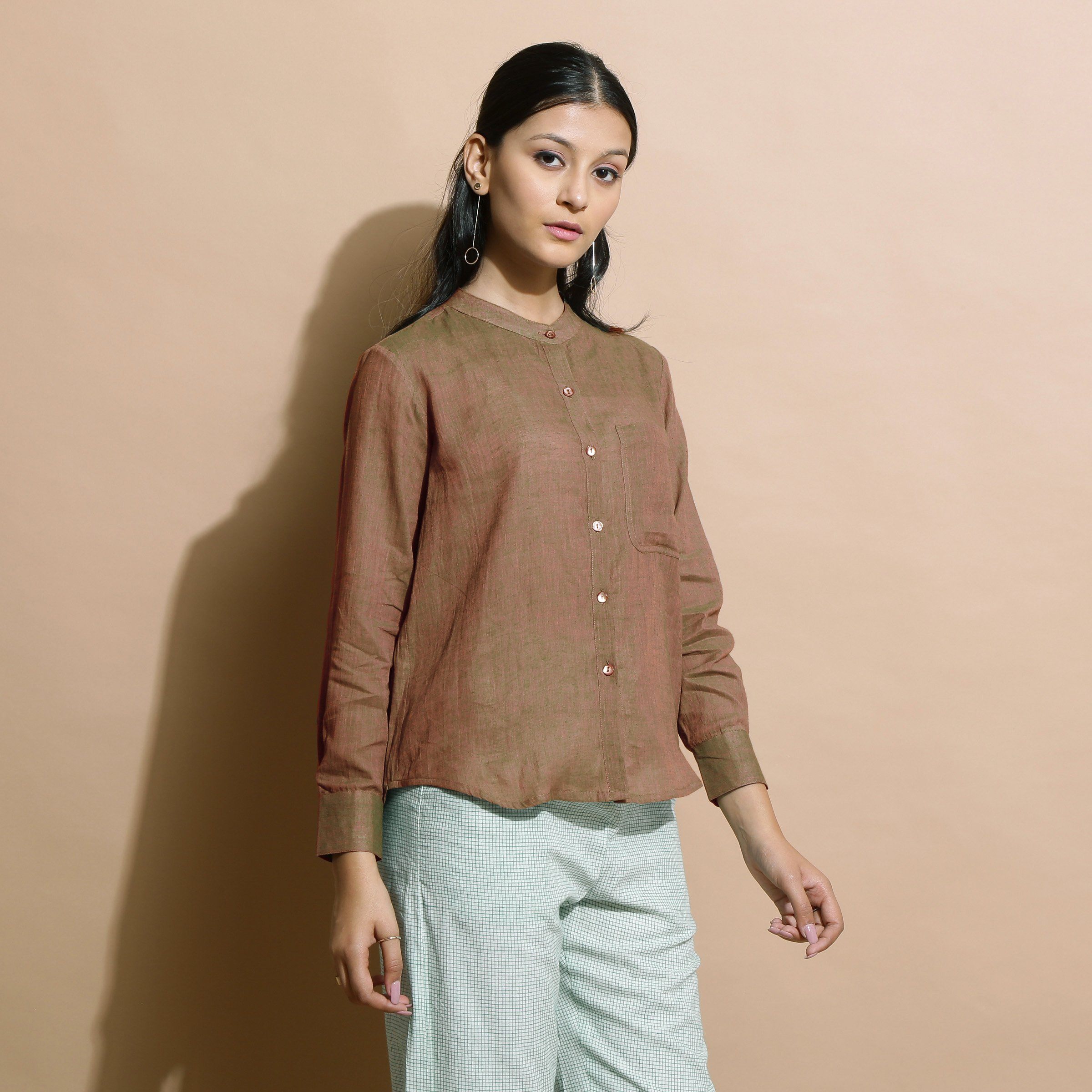 Right View of a Model wearing Handspun Brown Button Down Shirt