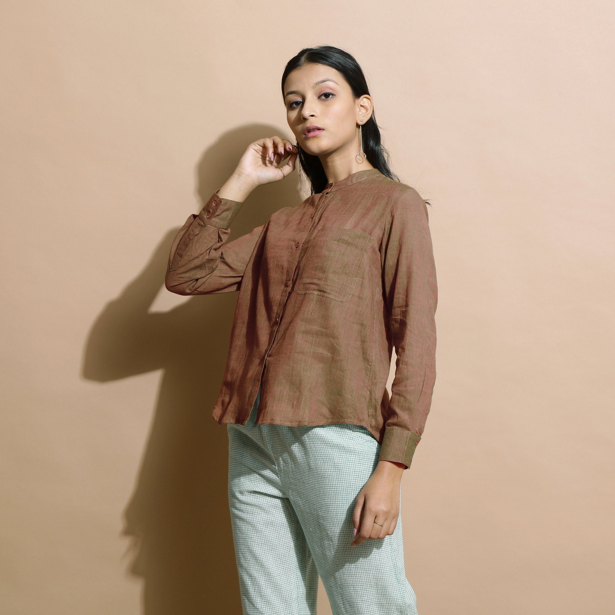 Left View of a Model wearing Handspun Brown Button Down Shirt