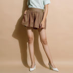 Front View of a Model wearing Handspun Brown Flared Shorts