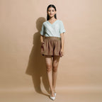Front View of a Model wearing Handspun Brown Flared Shorts