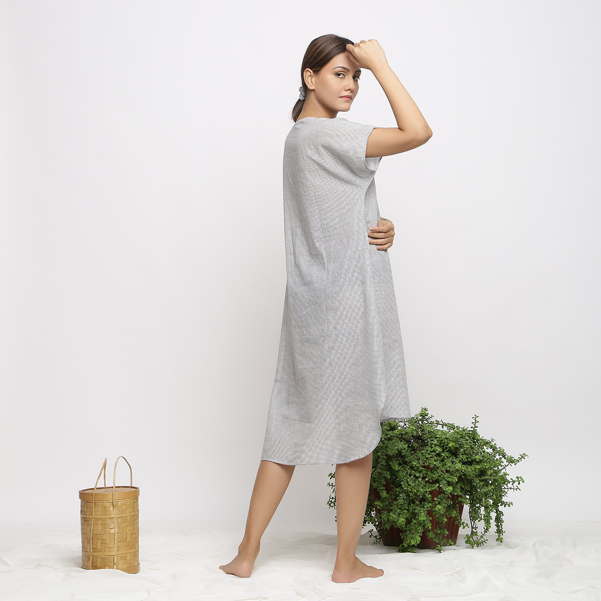 Back View of a Model wearing Off-White and Grey Checks Handspun Cotton Muslin High-Low Kaftan Dress