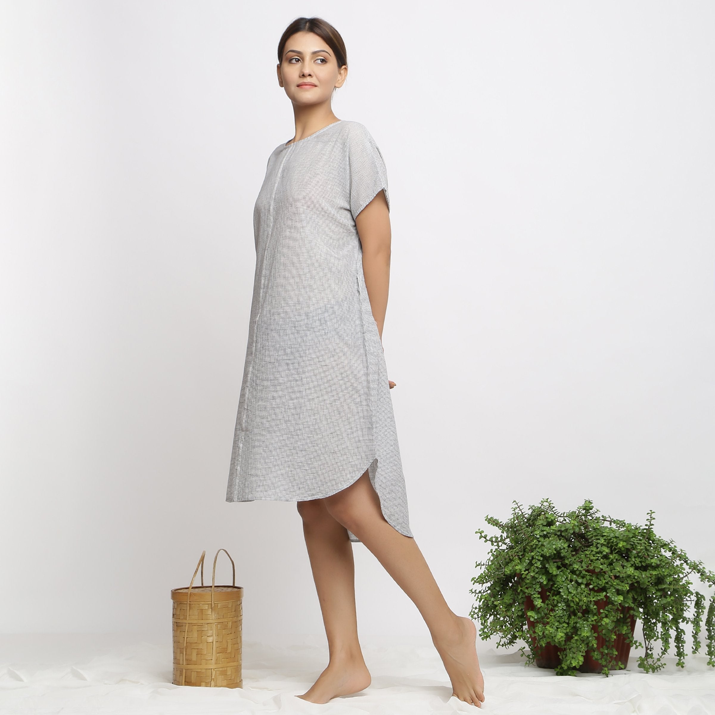 Left View of a Model wearing Off-White and Grey Checks Handspun Cotton Muslin High-Low Kaftan Dress