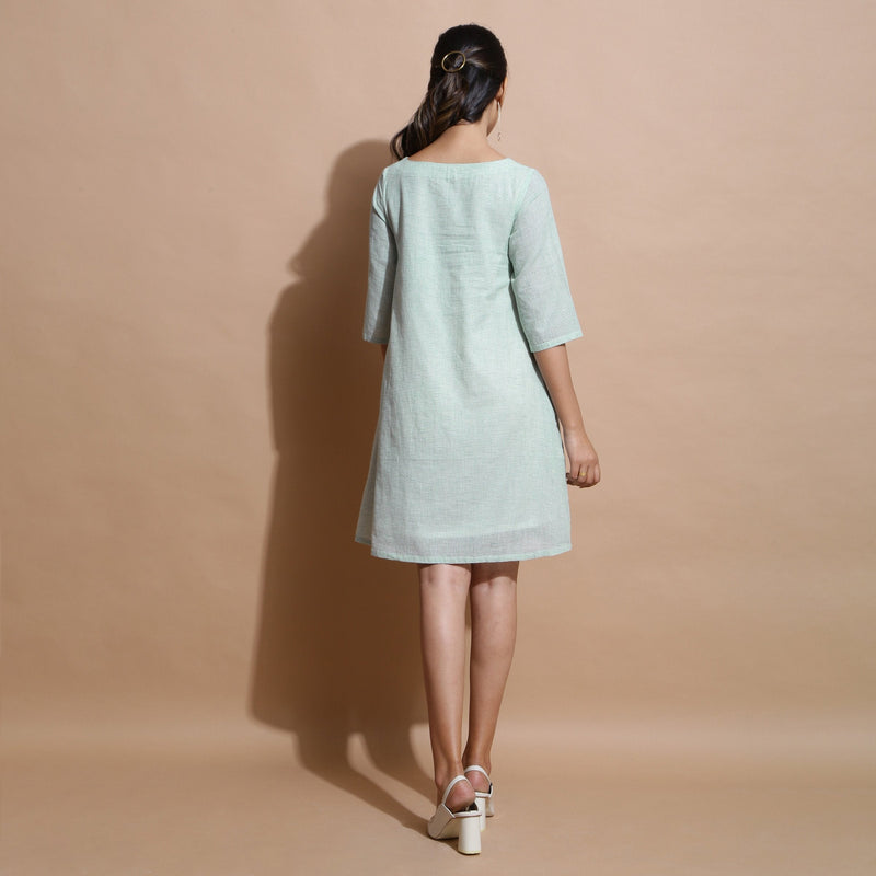 Back View of a Model wearing Light Green Handspun Cotton Muslin A-Line Short Dress