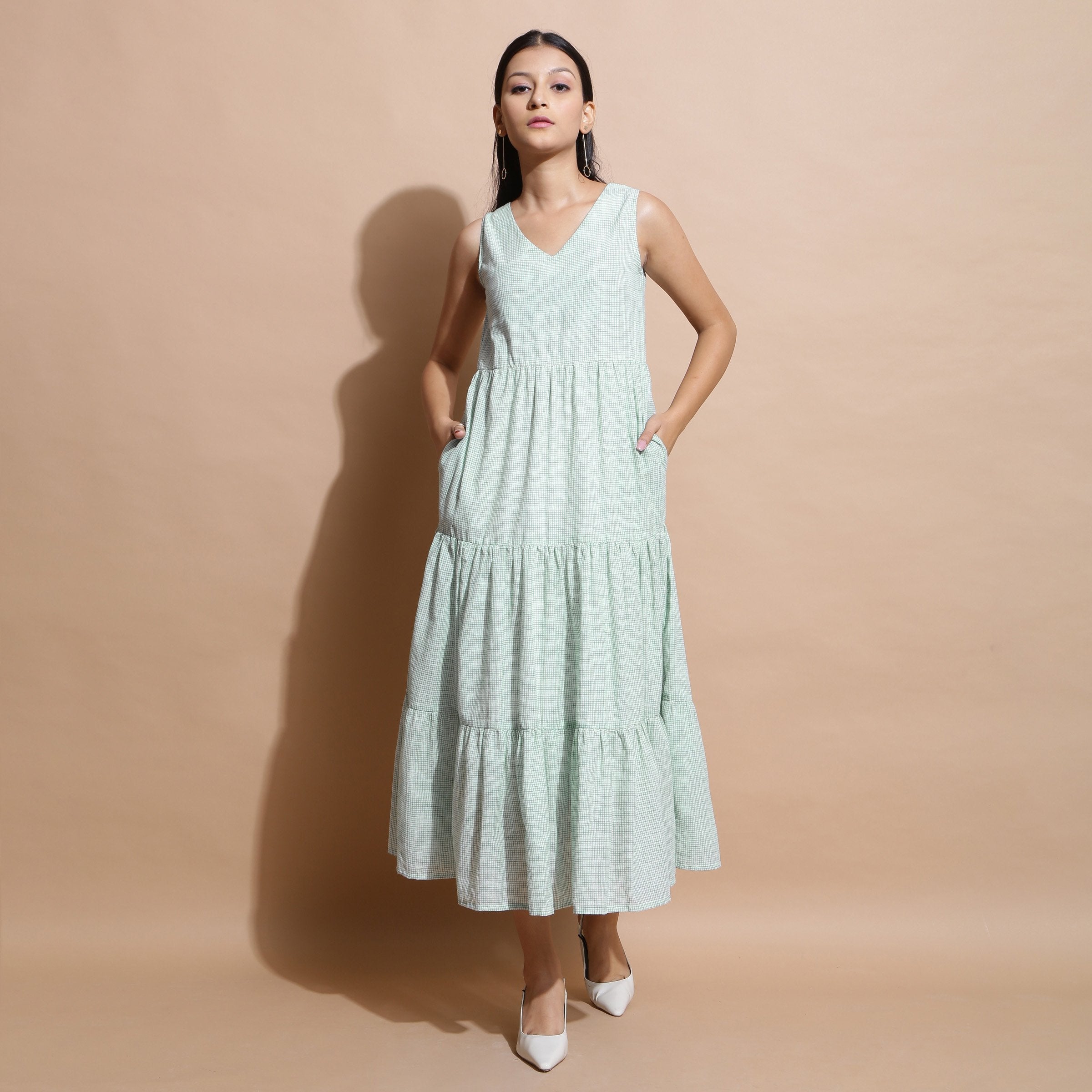 Front View of a Model wearing Light Green Cotton Muslin Checkered Maxi Tier Dress