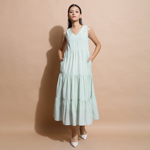 Front View of a Model wearing Light Green Cotton Muslin Checkered Maxi Tier Dress