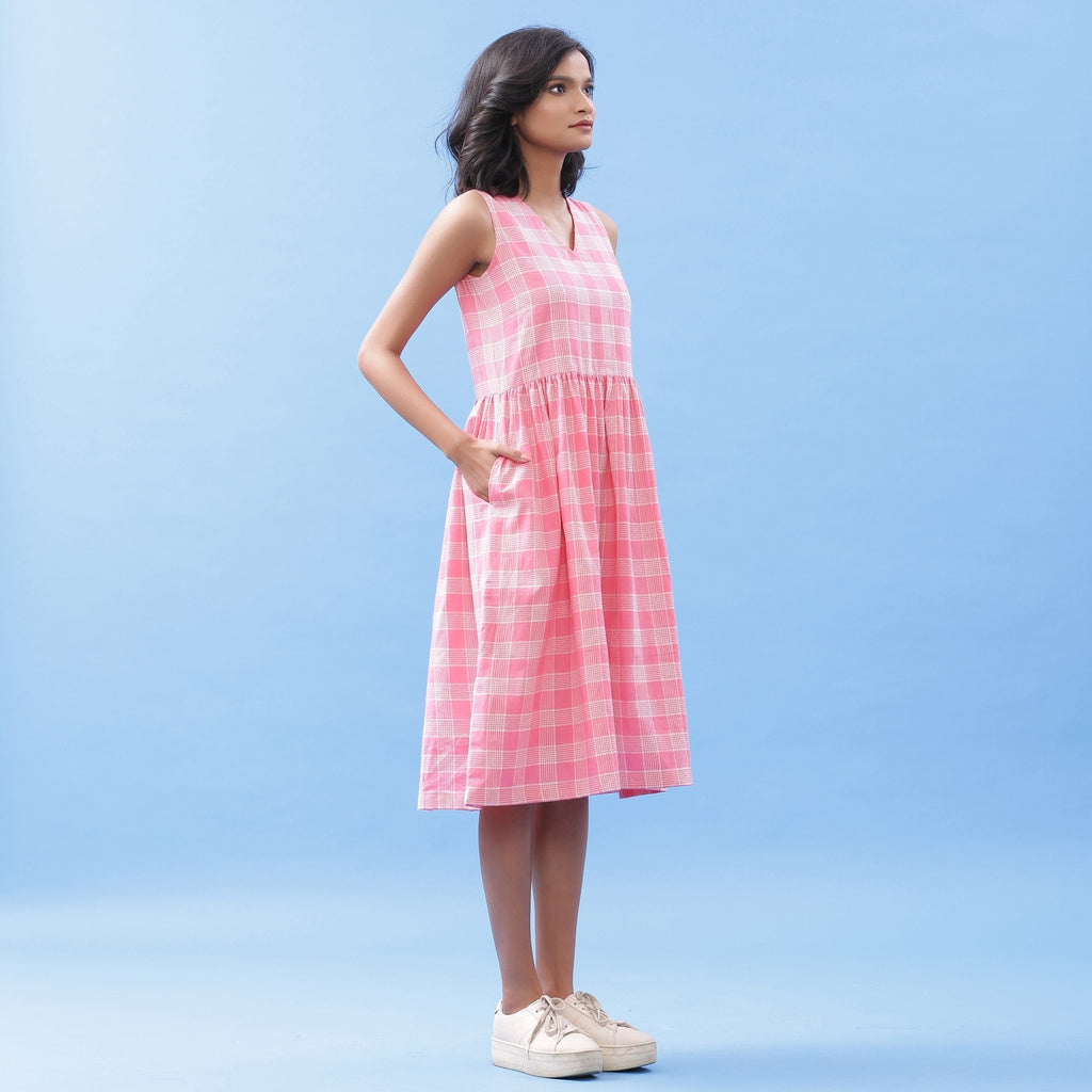 Right View of a Model wearing Pink Yarn Dyed Handspun Cotton V-Neck Yoked Midi Dress