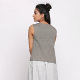 Back View of a Model wearing Handspun Grey Split Neck Sleeveless Top