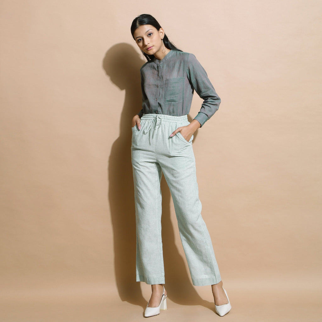 Front View of a Model wearing Light Green Checkered Cotton Muslin Elasticated Mid-Rise Pant
