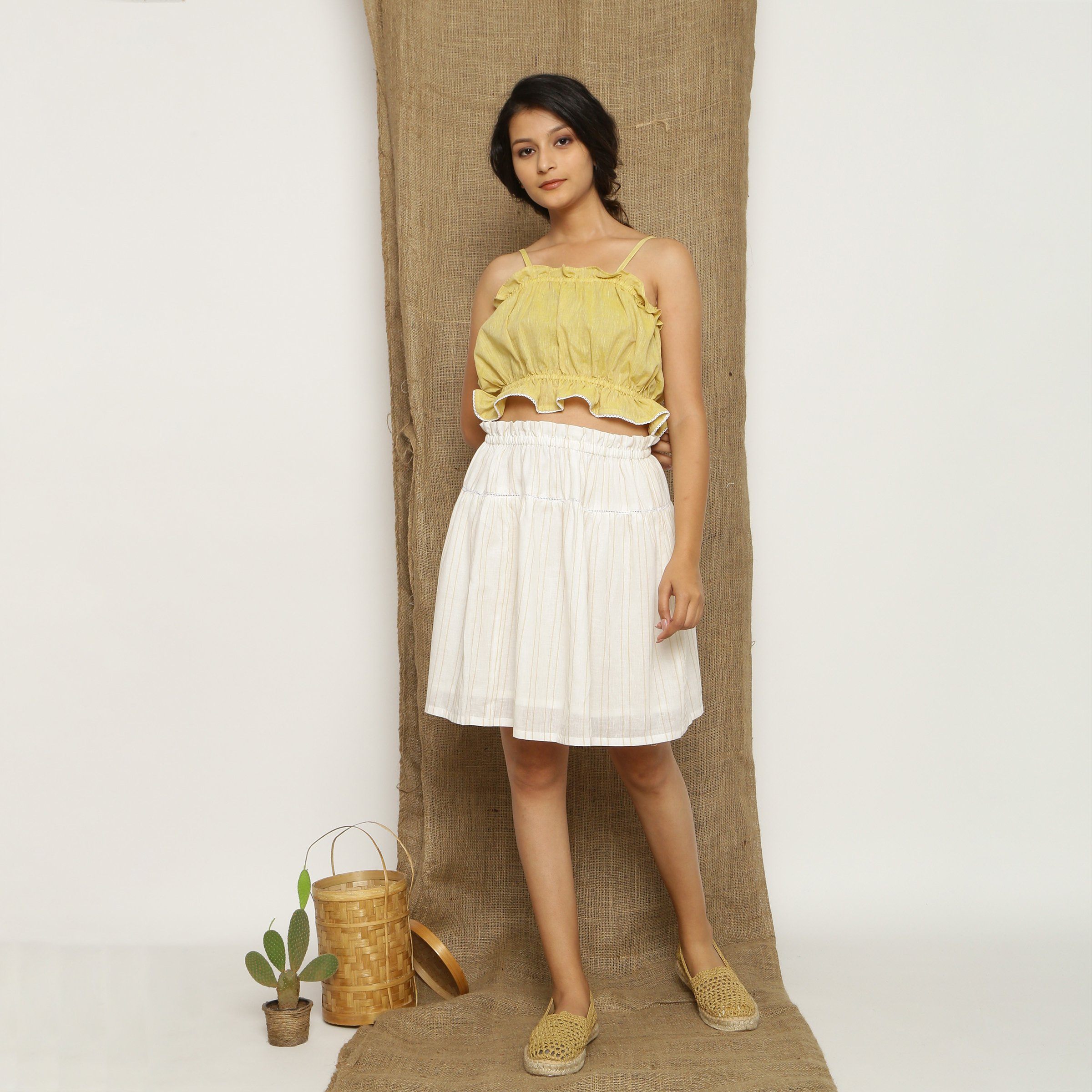 Front View of a Model wearing Handspun Light Yellow Balloon Top