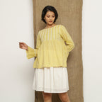 Front View of a Model wearing Handspun Light Yellow Poet Sleeve Top