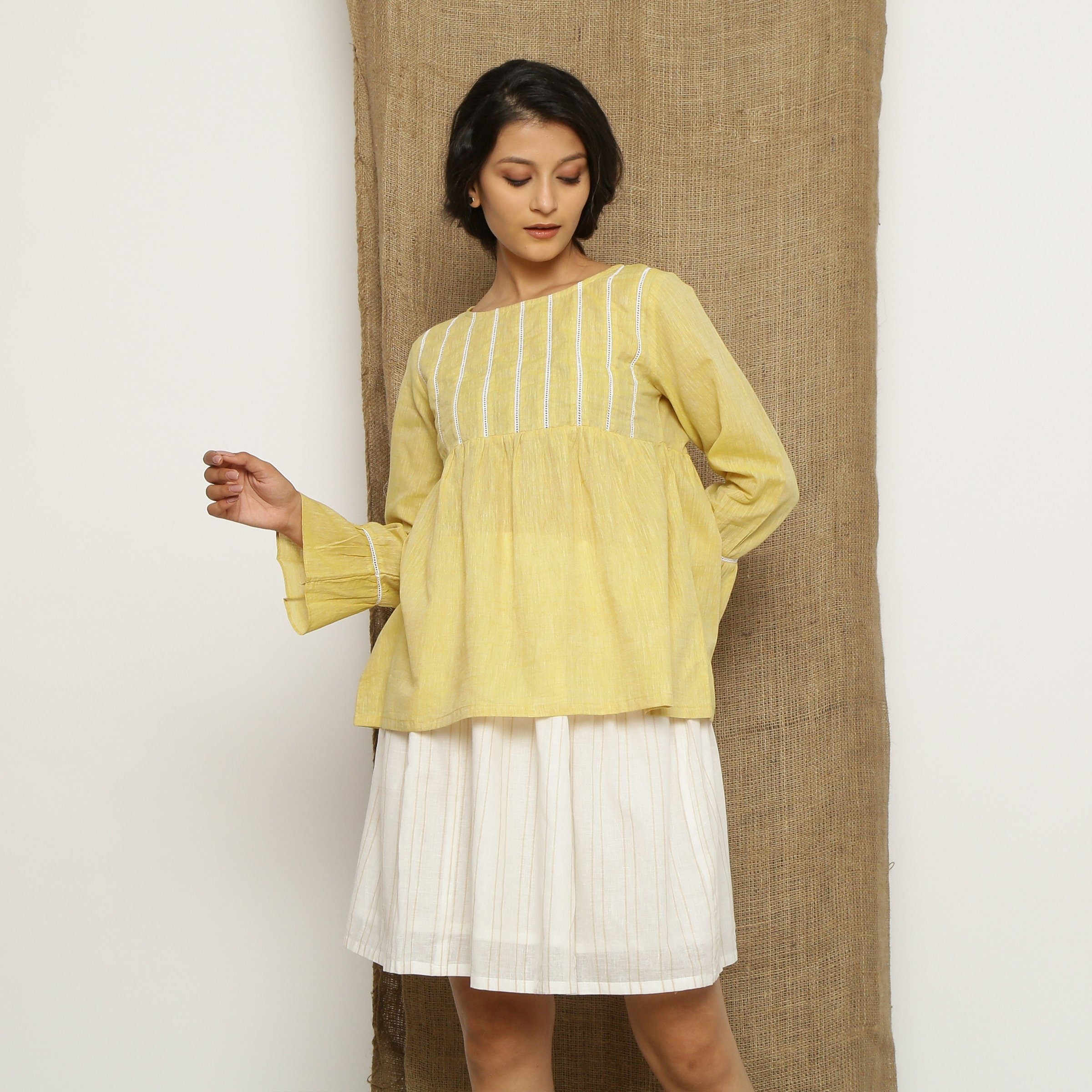Front View of a Model wearing Handspun Light Yellow Poet Sleeve Top