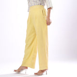 Left View of a Model wearing Handspun Light Yellow Wide Legged Pant