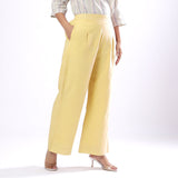 Right View of a Model wearing Handspun Light Yellow Wide Legged Pant