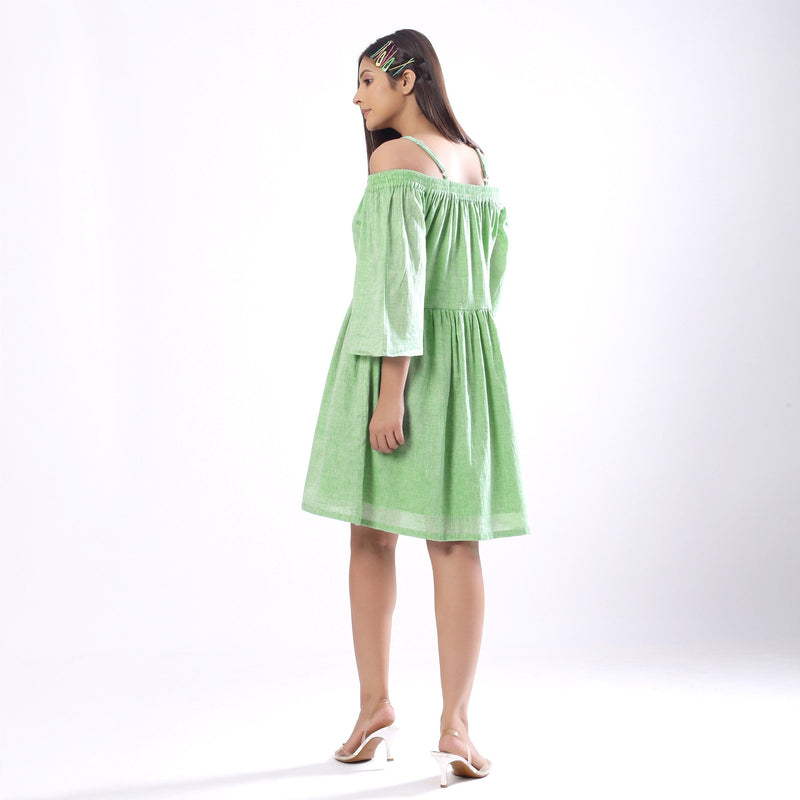 Back View of a Model wearing Handspun Mint Green Off-Shoulder Dress