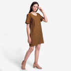 Right View of a Model wearing Handspun Oak Brown Button-Down Romper