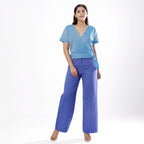 Front View of a Model wearing Handspun Sky Blue Wrap Top