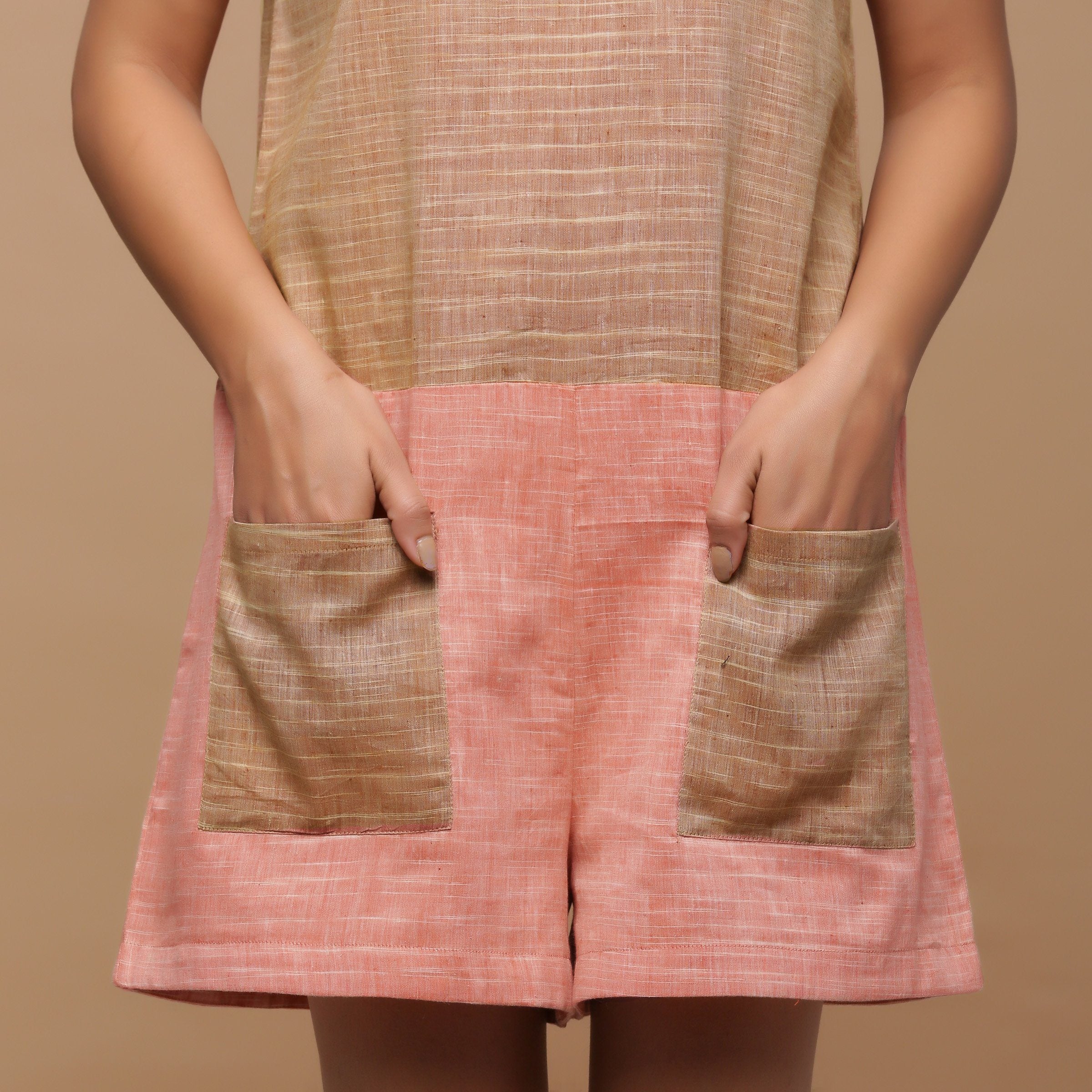Front Detail of a Model wearing Handspun Yoked Sleeveless Romper