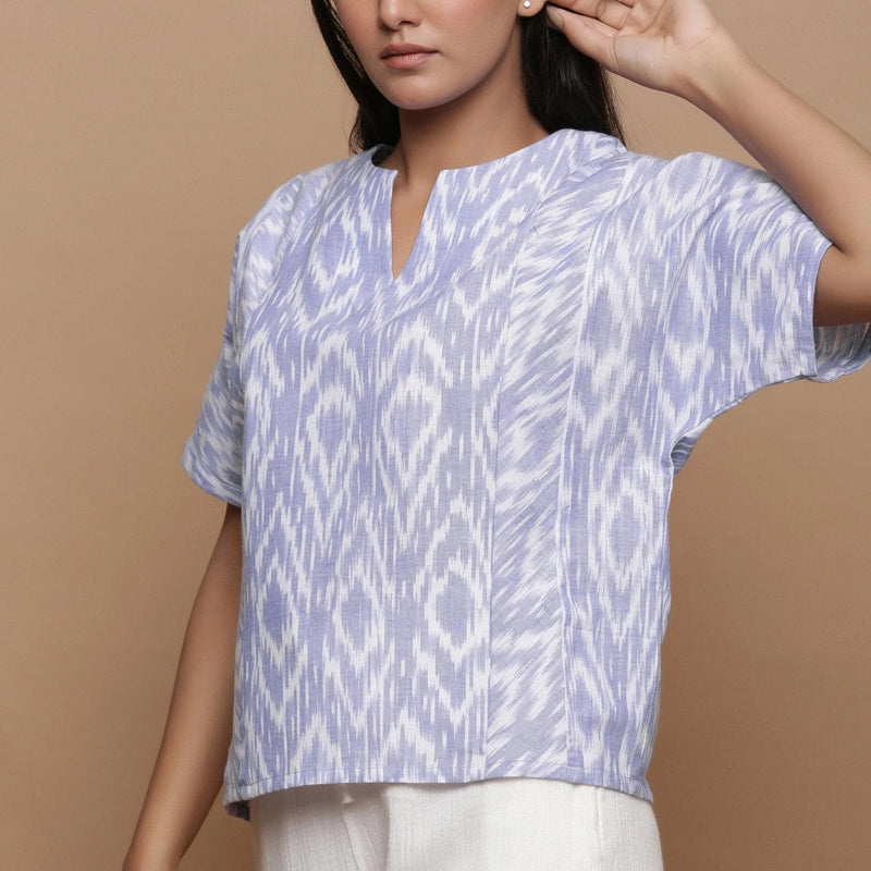 Front Detail of a Model wearing Ikat Powder Blue Split Neck Top