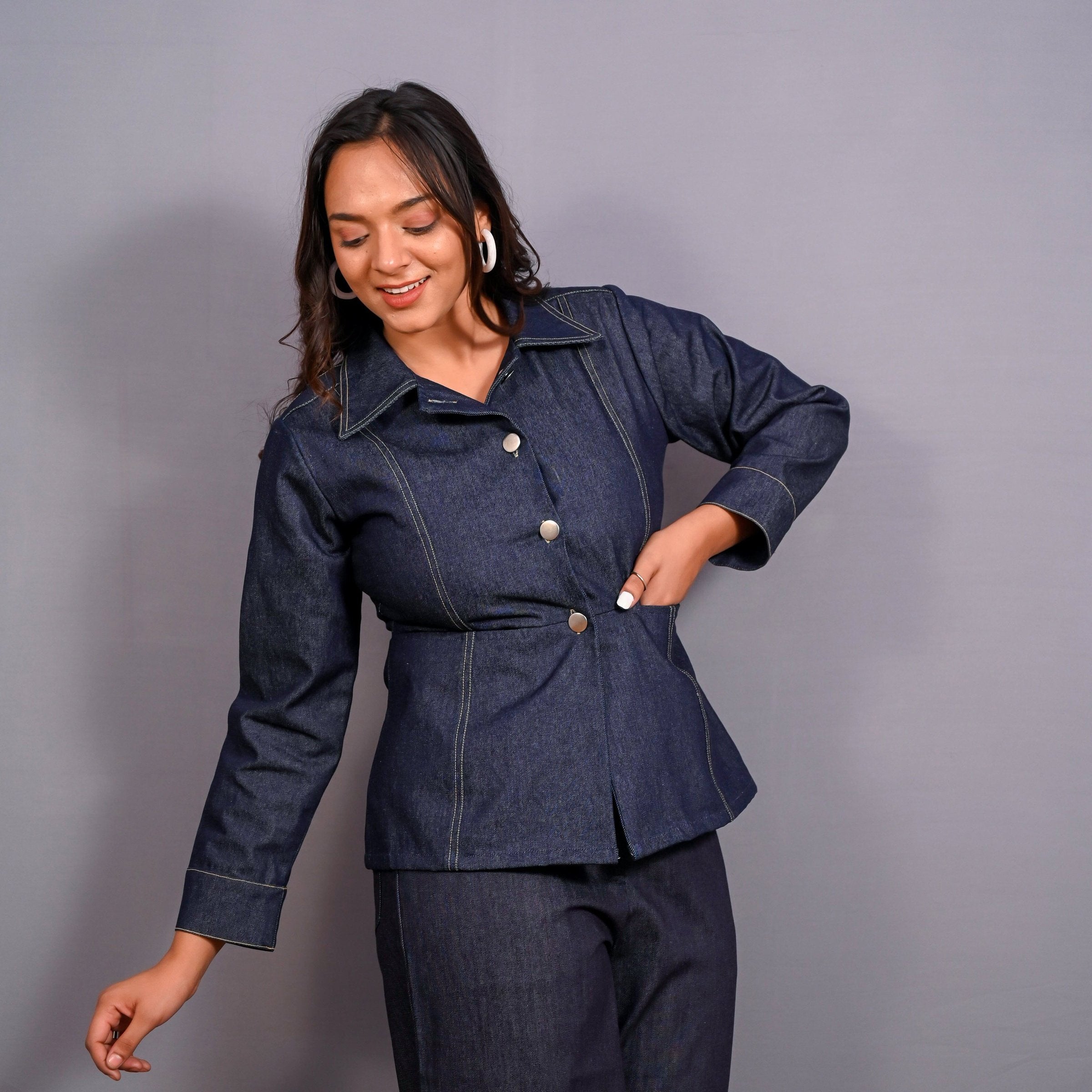 Right View of a Model wearing Indigo Cotton Denim Button-Down Peplum Top