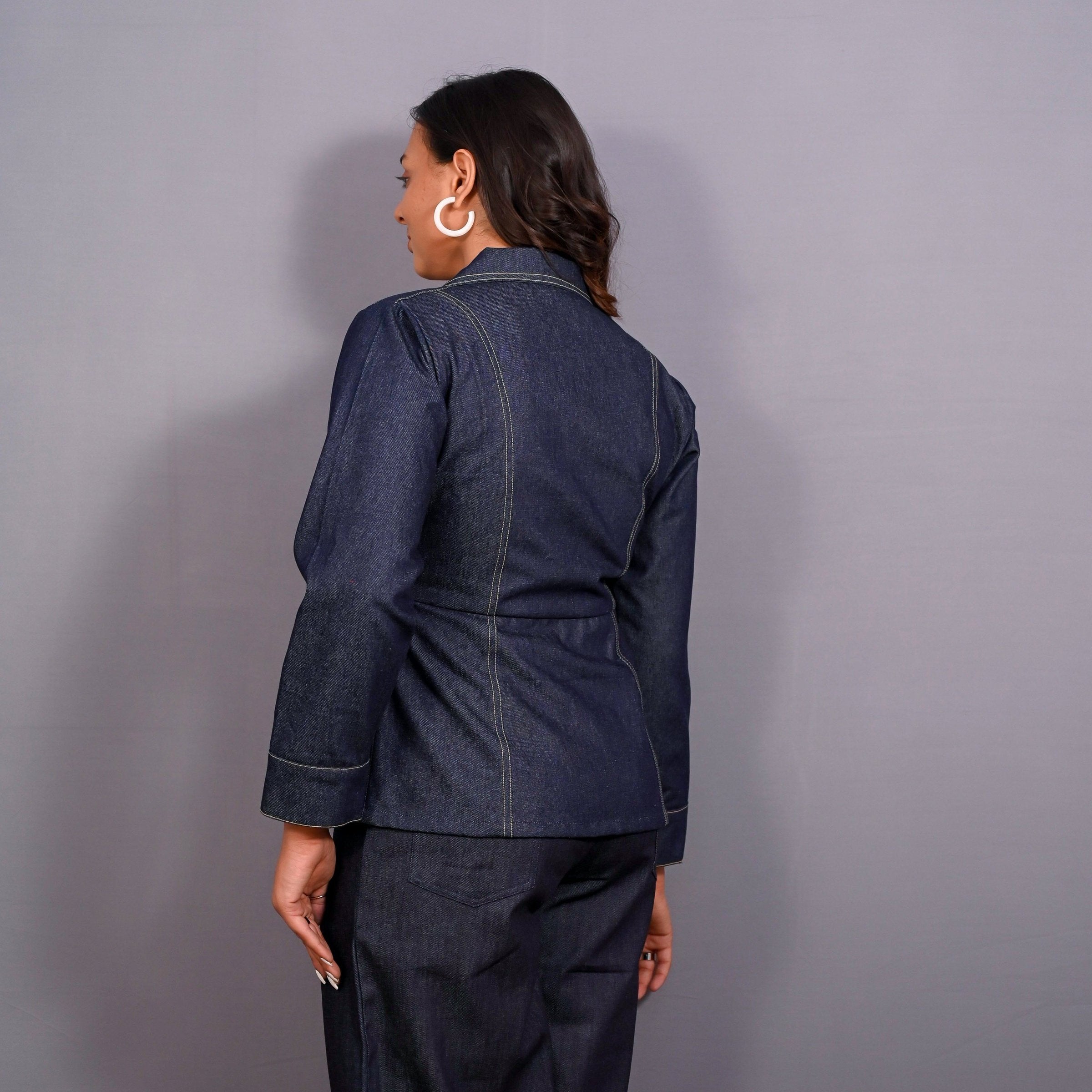Back View of a Model wearing Indigo Cotton Denim Button-Down Peplum Top