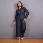 Front View of a Model wearing Indigo Cotton Denim Button-Down Peplum Top