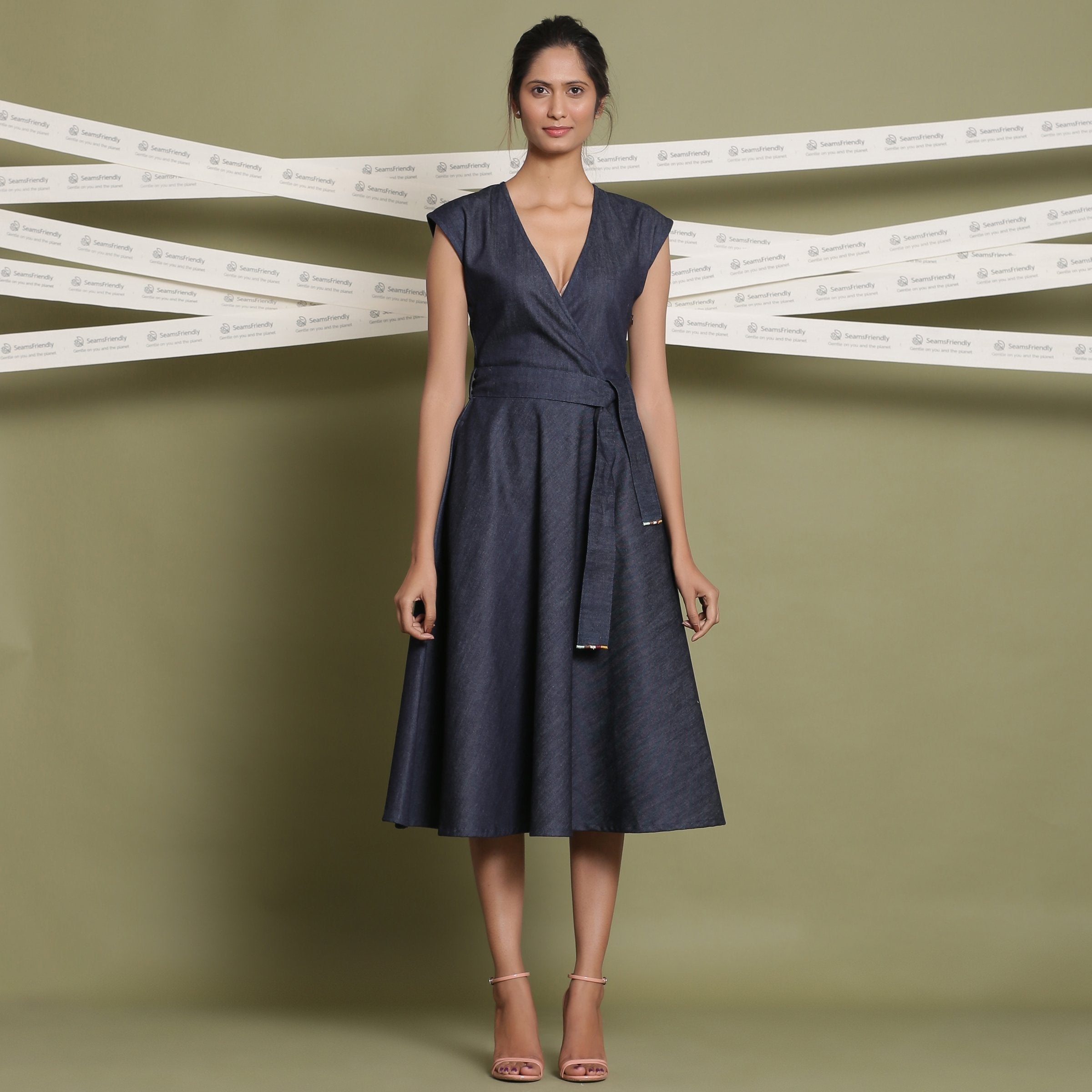 Front View of a Model wearing Indigo Cotton Denim V-Neck Fit and Flare Midi Dress