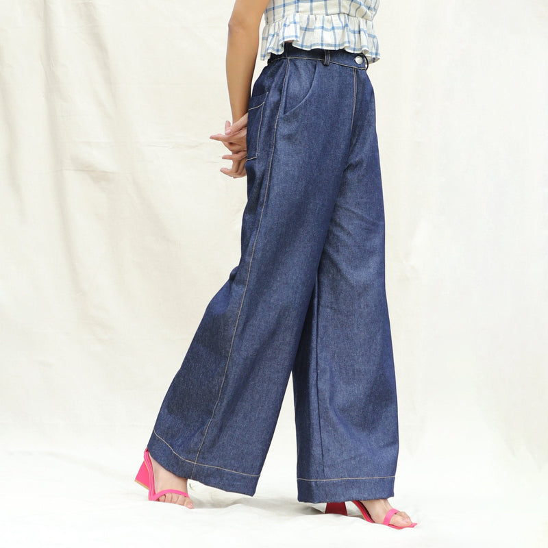 Right View of a Model wearing Indigo Cotton Denim High-Rise Elasticated Wide Legged Pant
