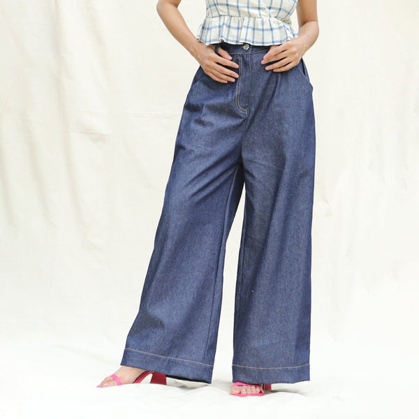Front View of a Model wearing Indigo Cotton Denim High-Rise Elasticated Wide Legged Pant