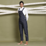 Left View of a Model wearing Indigo 100% Cotton Denim Strap Sleeve Dungaree