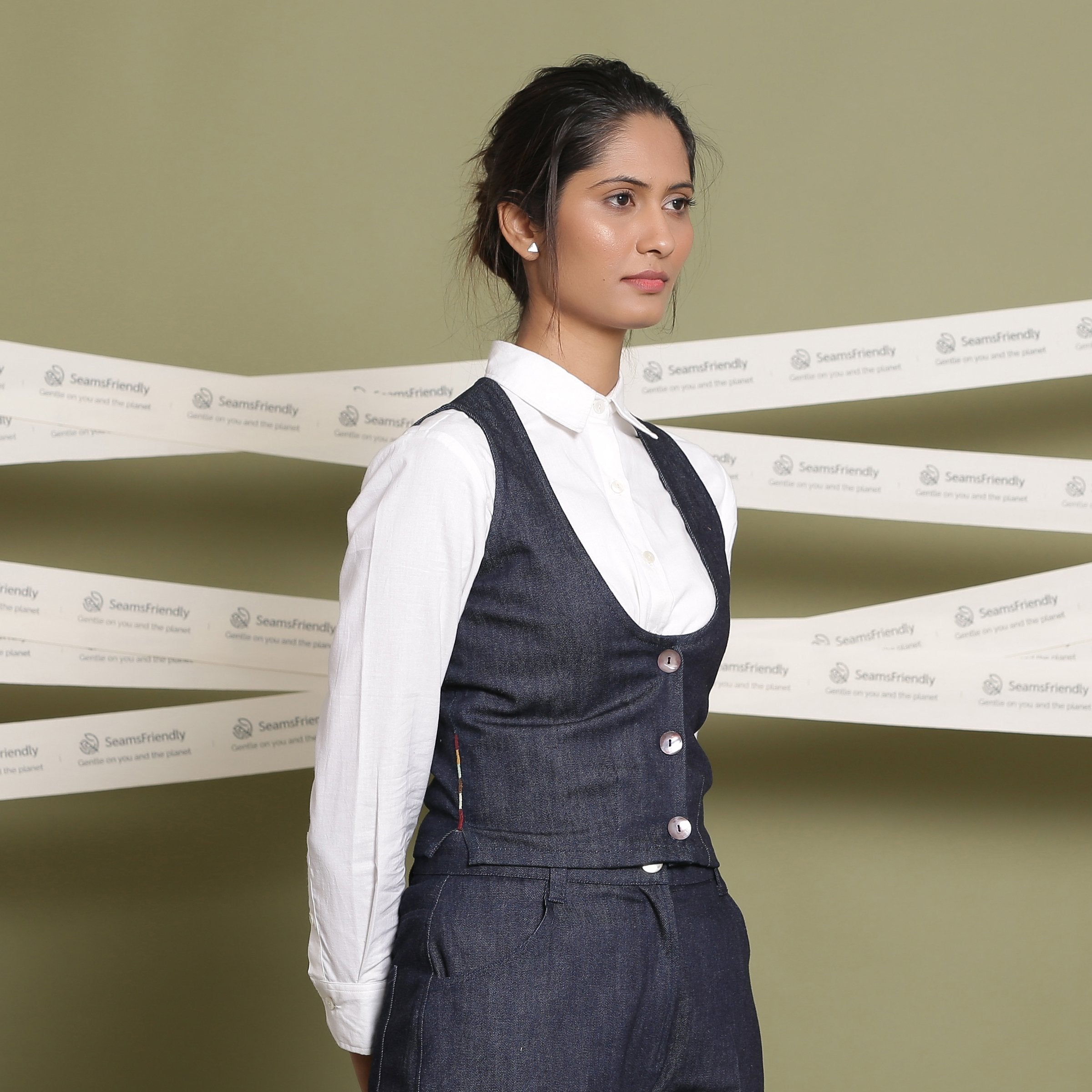Front View of a Model wearing Indigo 100% Cotton Denim U-Neck Sleeveless Vest