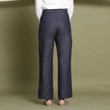 Back View of a Model wearing Indigo Cotton Denim Wide Legged Jeans
