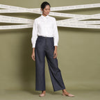 Front View of a Model wearing Indigo Cotton Denim Wide Legged Jeans