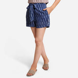 Left View of a Model wearing Indigo Dabu Print High Rise Comfort Fit Shorts