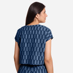 Back View of a Model wearing Indigo Dabu Block Print V-Neck Crop Top