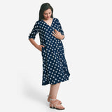 Right View of a Model wearing Indigo Polka Dot Block Print Cotton Midi Dress
