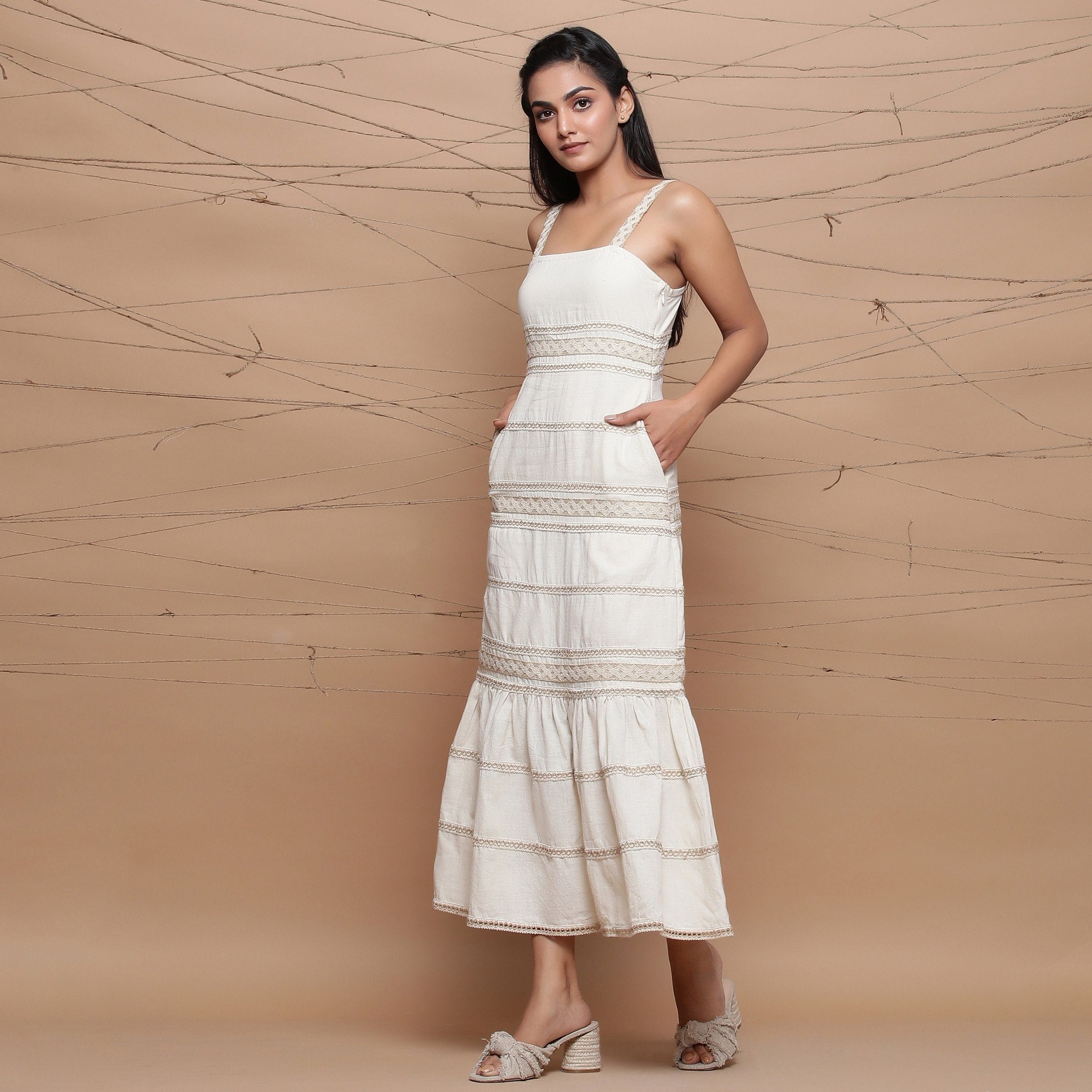 Left View of a Model wearing Jute Laced Handspun Sheath Dress