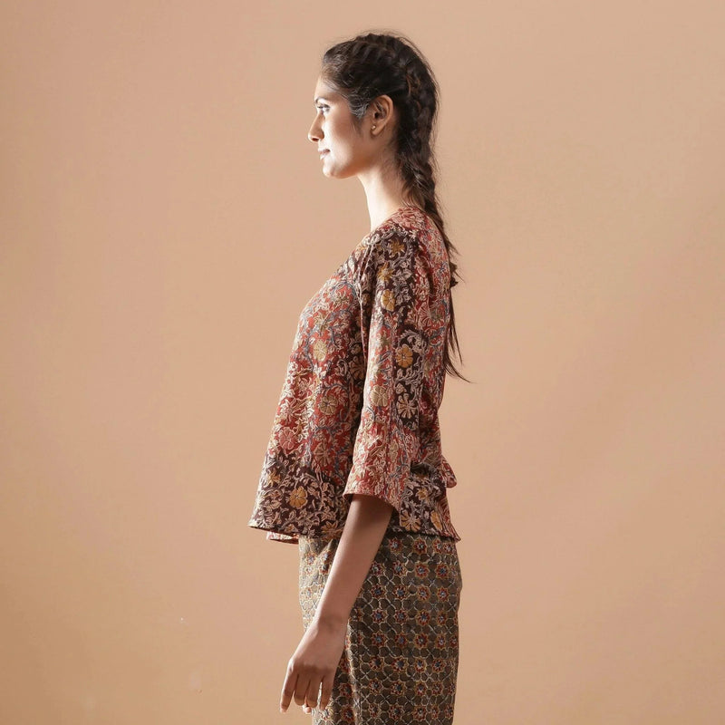 Left View of a Model wearing Muddy Red Kalamkari Raglan Sleeves Top