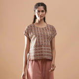 Front View of a Model wearing Kalamkari Cotton Chevron Yoked Top