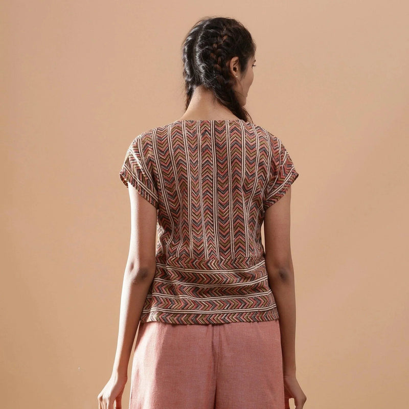 Back View of a Model wearing Kalamkari Cotton Chevron Yoked Top