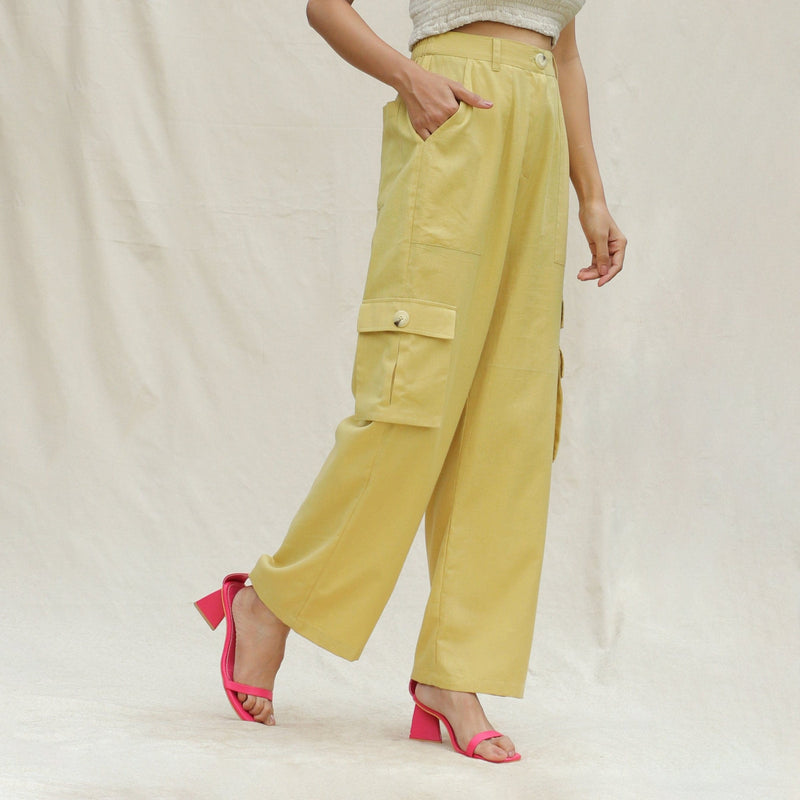 Right View of a Model wearing Khakhi Green Cotton Flax High-Rise Cargo Pant