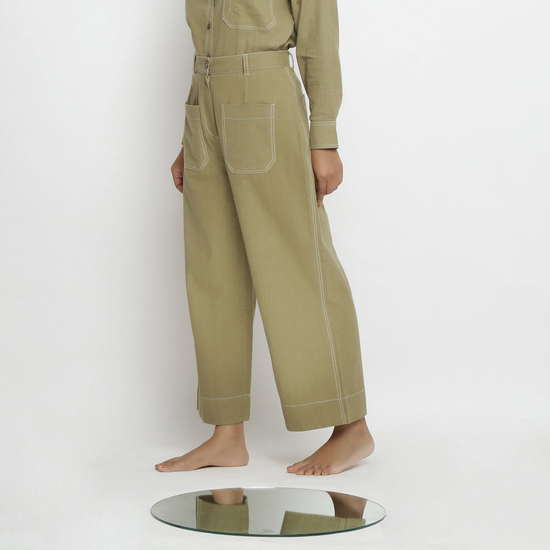 Left View of a Model wearing Khaki Green Vegetable Dyed Handspun Cotton Patch Pocket Wide Legged Pant