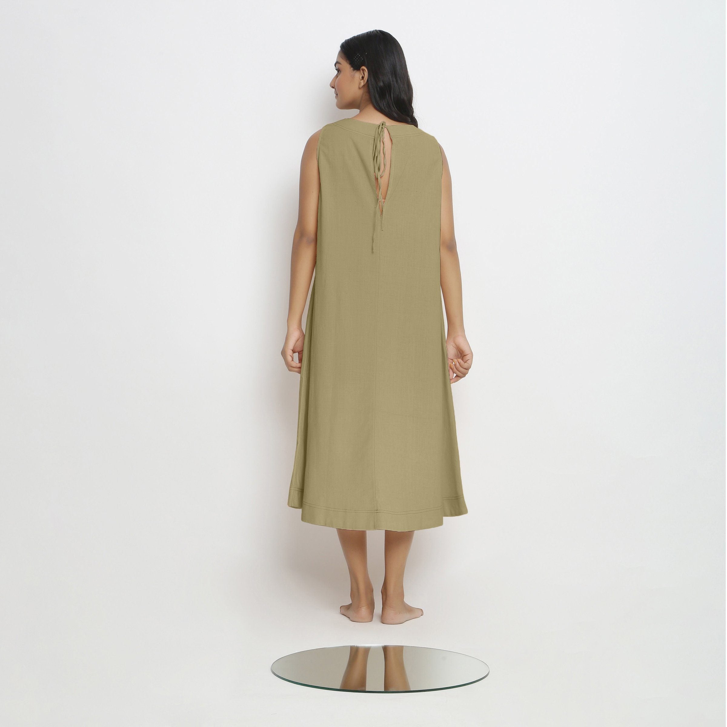 Back View of a Model wearing Khaki Green Vegetable Dyed A-Line Paneled Dress