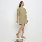 Right View of a Model wearing Khaki Green Vegetable Dyed Romper