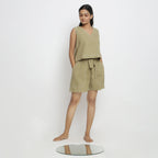 Right View of a Model wearing Khaki Green Vegetable Dyed Handspun Cotton Sleeveless Crop Top